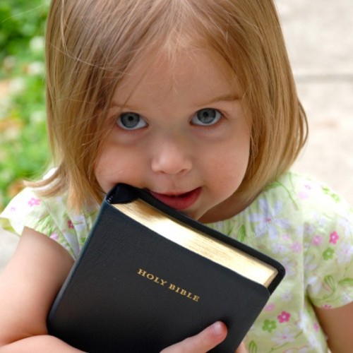 This little one picked up her dad's Bible on the way out of church.